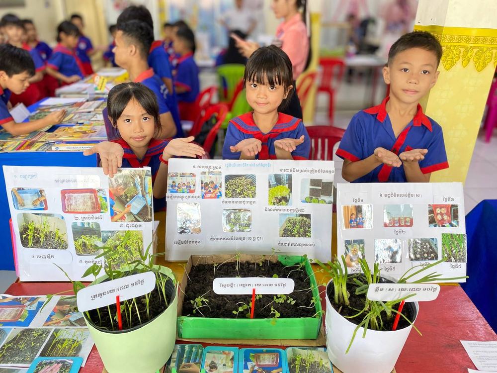 Students presenting a plant-growth science project