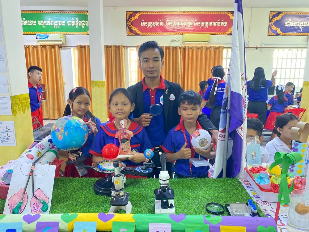 Teacher and students at the science exhibition